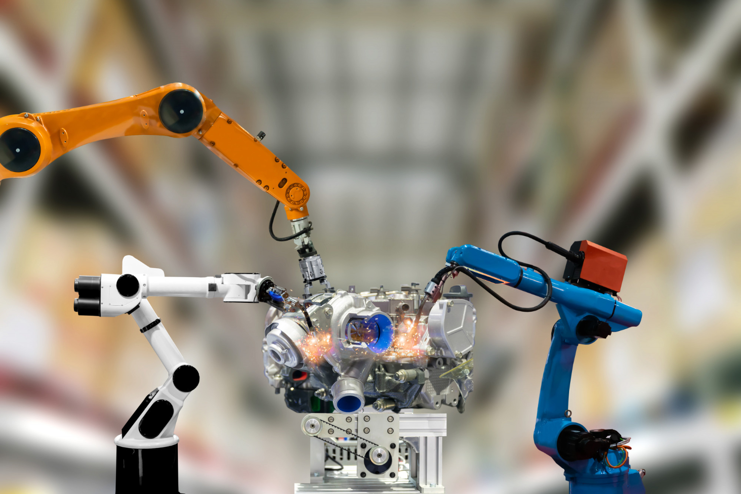 Industrial robots assembling an automotive component